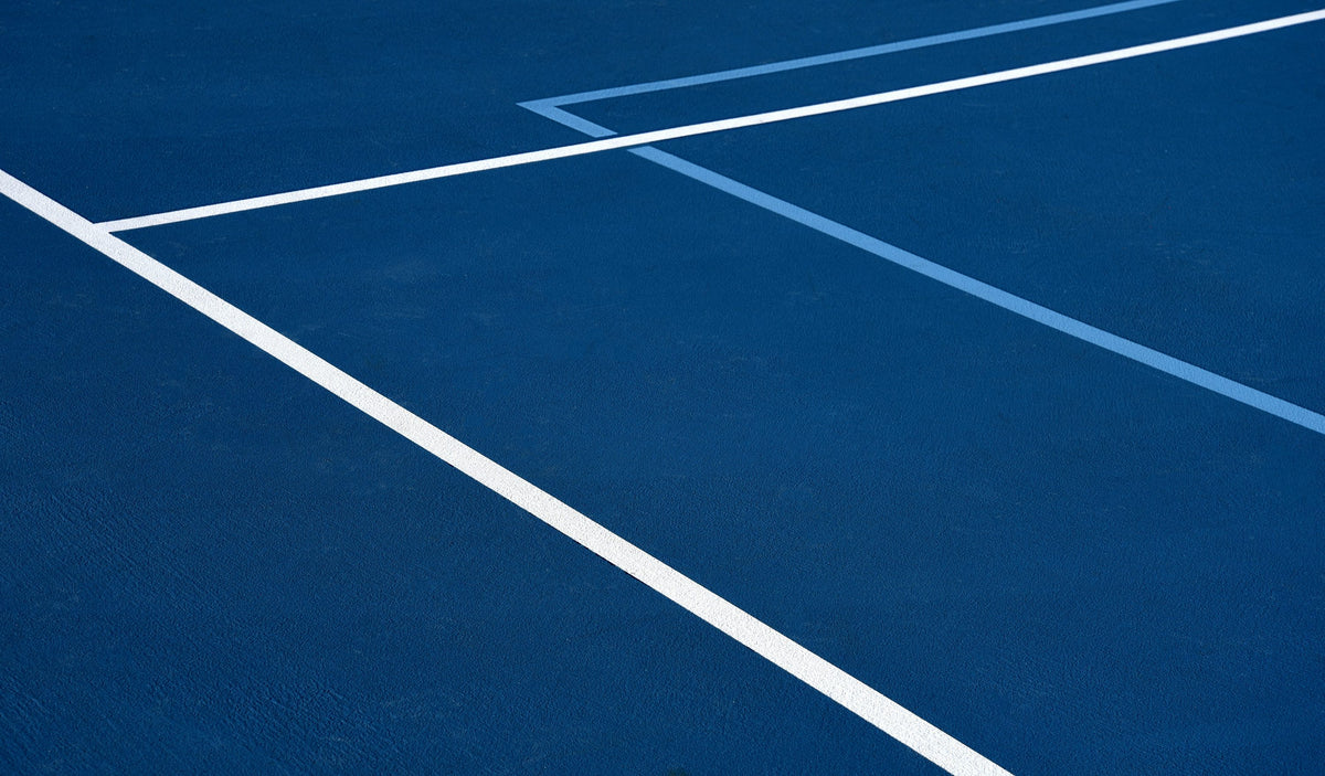 Blue and white pickleball court from above