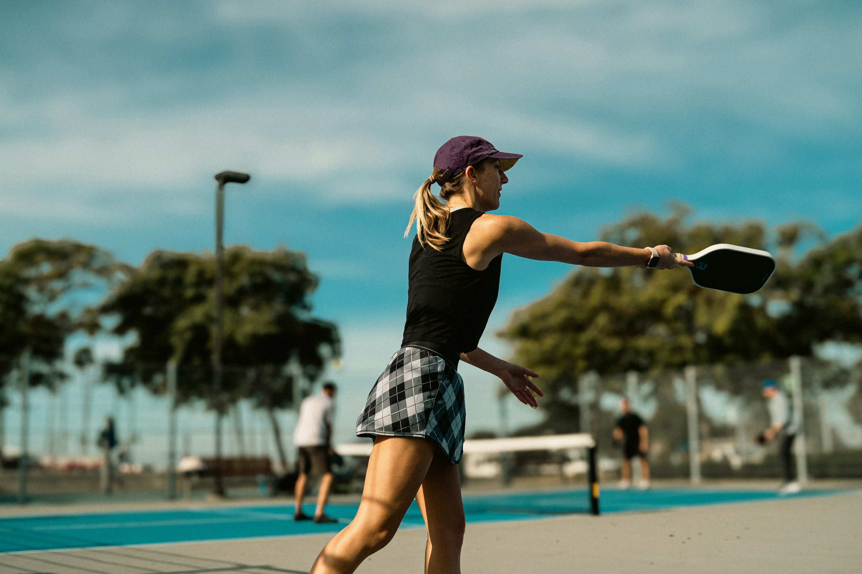 A player in action on a pickleball court
