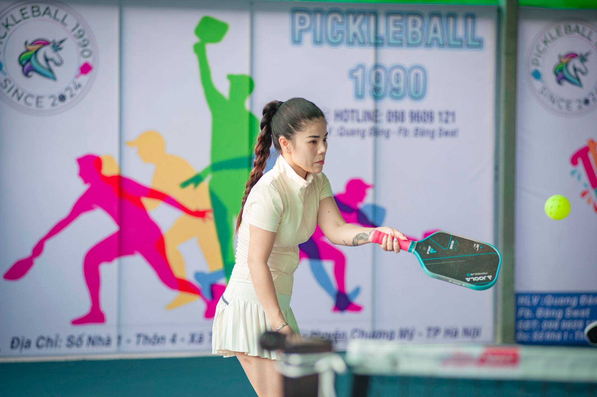Woman playing pickleball outdoors