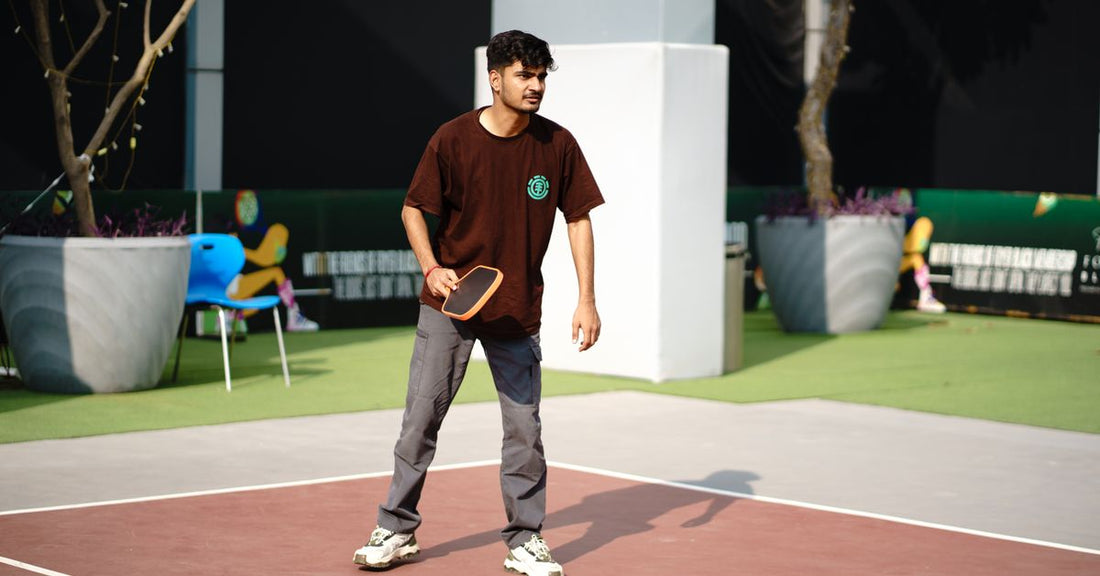 Man playing pickleball on an outdoor court