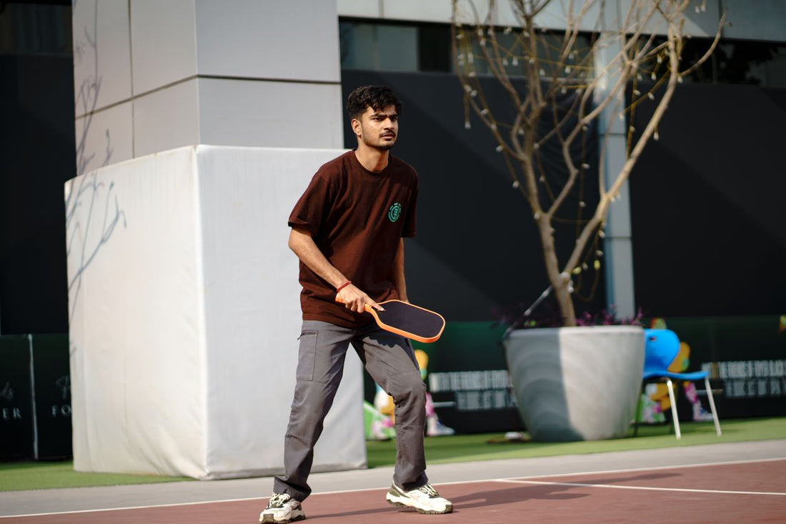Young player engaged in an outdoor pickleball game