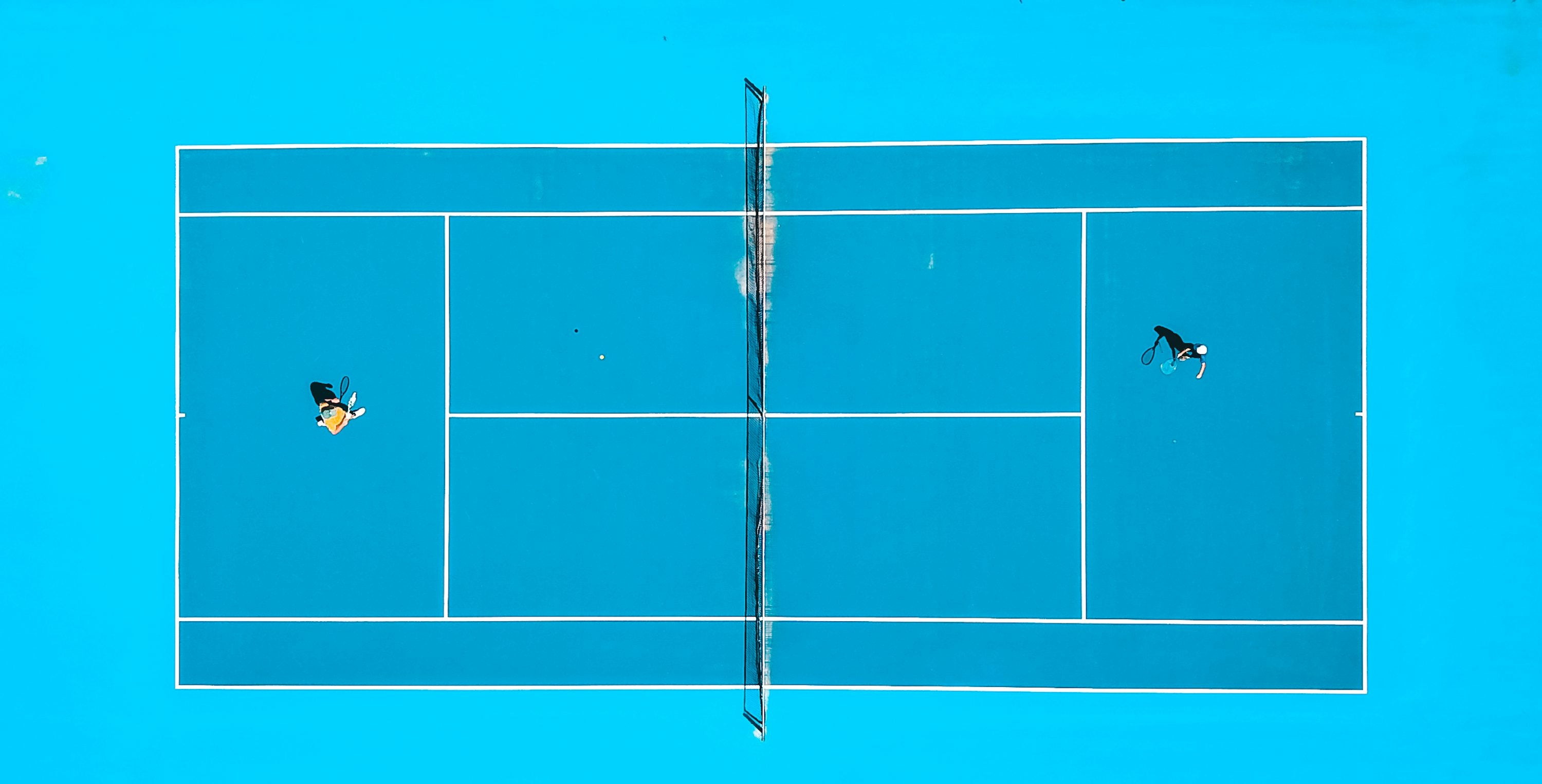 Aerial view of two players on a pickleball court