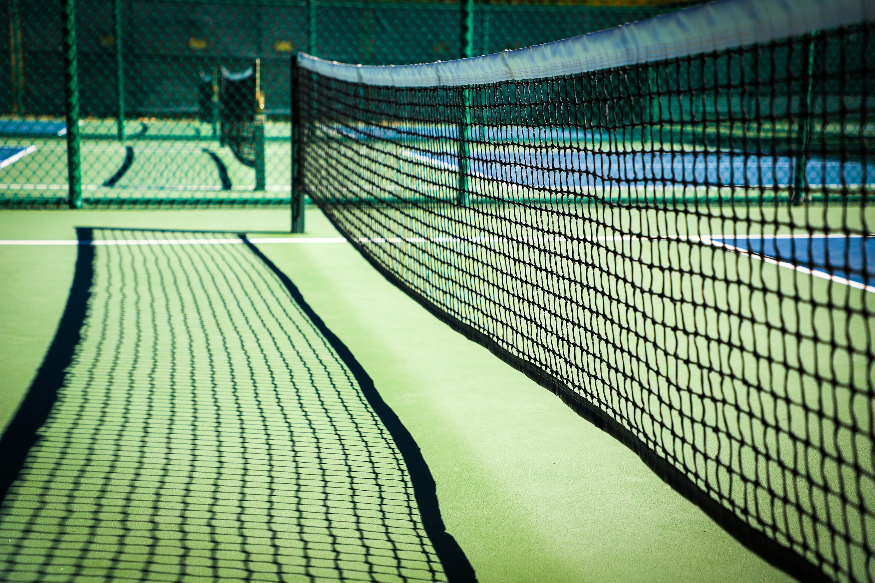 Close-up of a pickleball net on the court