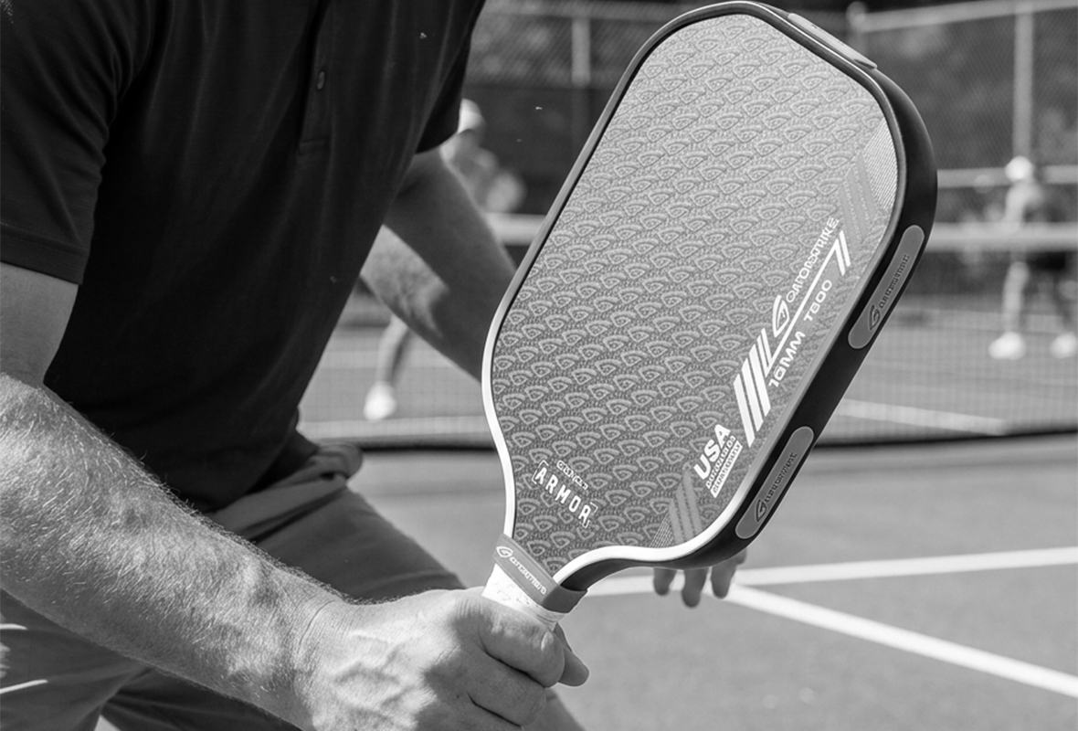 Five gray Goostrike products stand upright in a row, each with a differently colored accent: purple, green, white, neon yellow, and black. The Goostrike logo is visible on each.