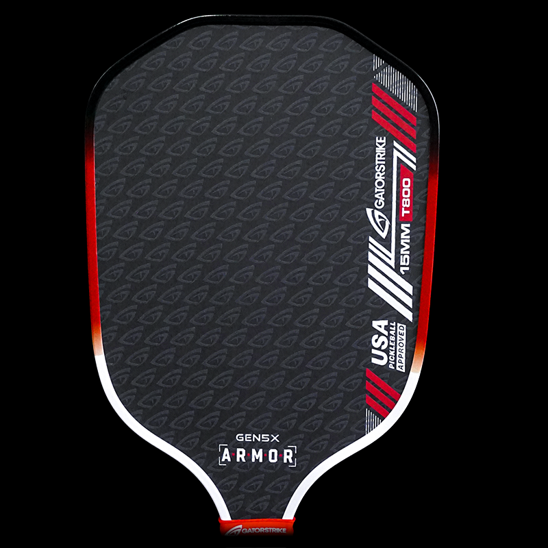 A black pickleball paddle with a subtle gray repeating logo pattern, red and white stripes on the right, “USA Pickleball Approved,” “GENS X ARMOR,” and “GatorStrike T600,” with a red accent at the base and edge details.