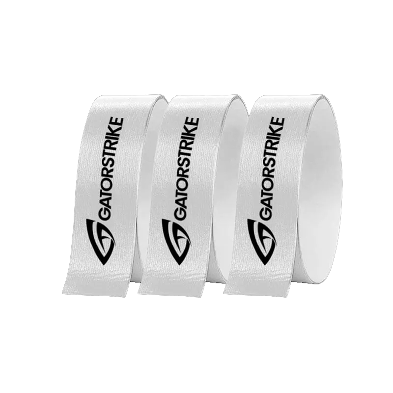 Three upright rolls of white ribbon, each with the black GATORSTRIKE logo and bold text, are shown on a plain light gray background. Perfect for use as pickleball paddle edge guard or edge protection. Brand Name: GATORSTRIKE.
