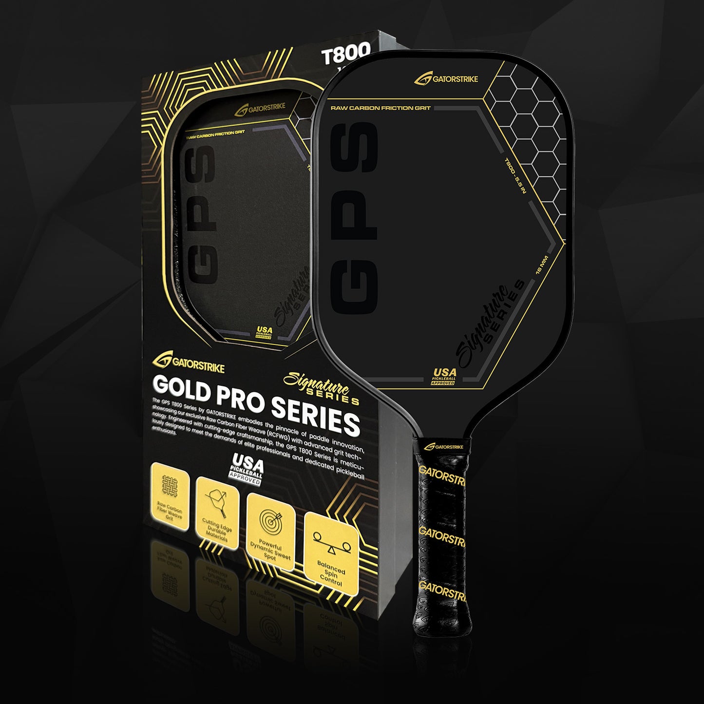 A black and gold carbon fiber pickleball paddle from the GATORSTRIKE Gold Pro Series is shown in its packaging, which features geometric designs, icons, and text about anti-vibration foam, USA design, and professional-grade quality.