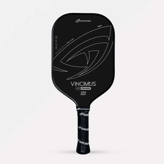 Black GatorStrike Vincimus pickleball paddle with explosive pop, bold silver logo, and patterned handle on a white background.