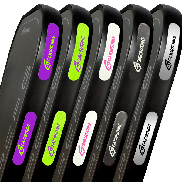Six black rectangular sports rebounders are lined up side by side. Each features a colored "GATORSTRIKE" logo and matching accents, making them an ideal pickleball accessory for training paddle weight and balance.
