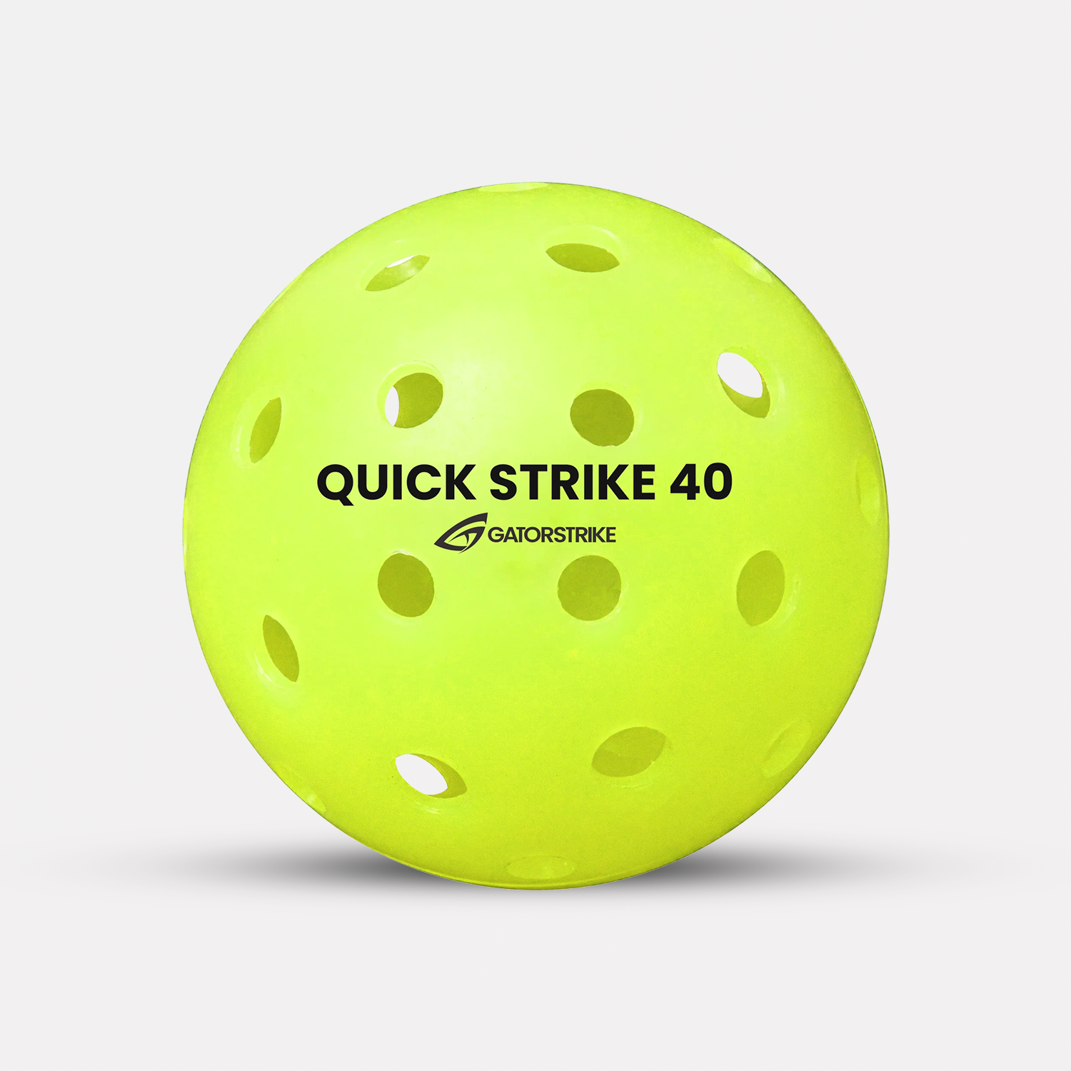 A yellow Quick Strike 40 ball made of high-impact polymer, labeled GATORSTRIKE, on a white background.