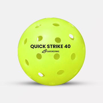A yellow Quick Strike 40 ball made of high-impact polymer, labeled GATORSTRIKE, on a white background.