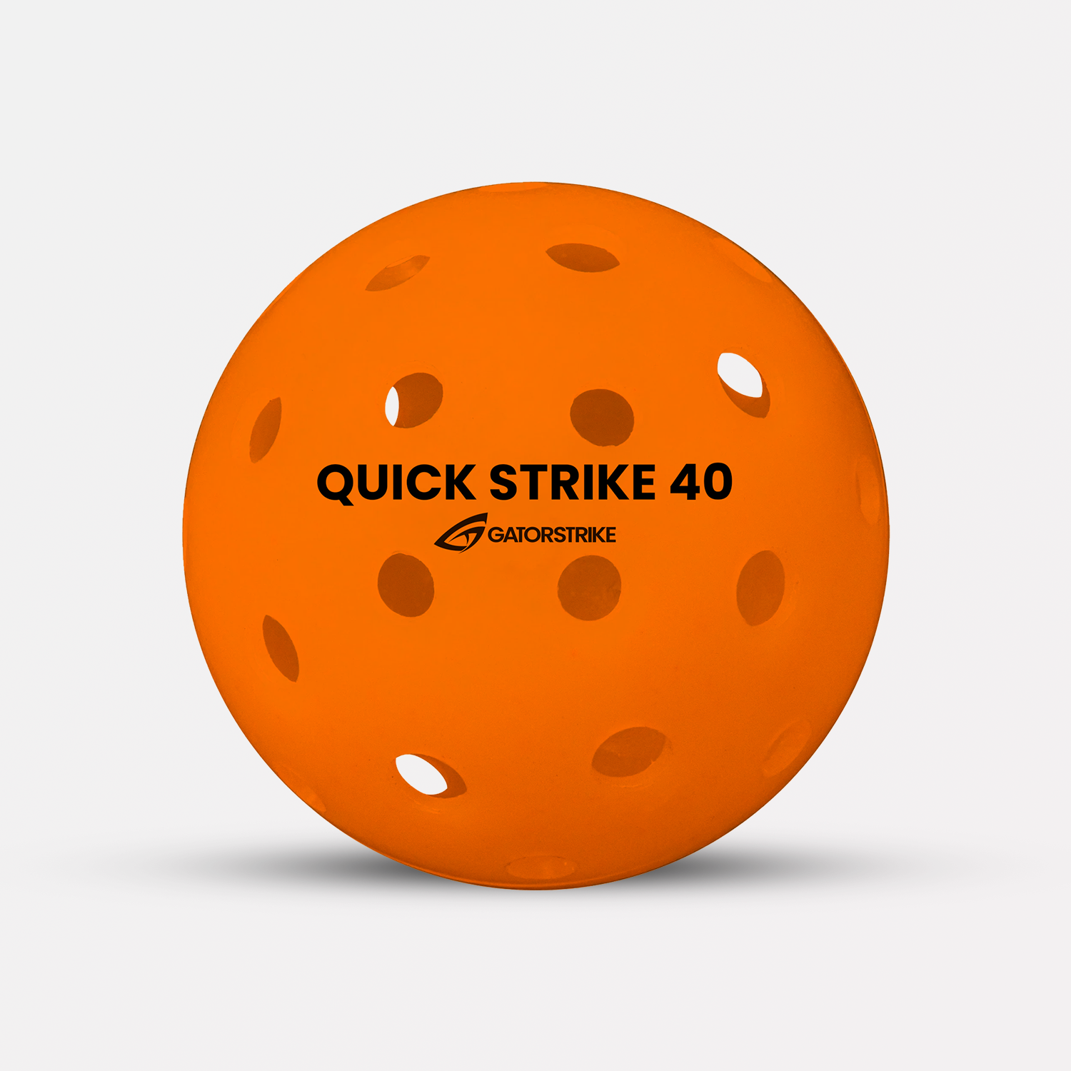 Orange perforated plastic ball features a precision 40-hole pattern, labeled QUICK STRIKE 40 GATORSTRIKE on white background.