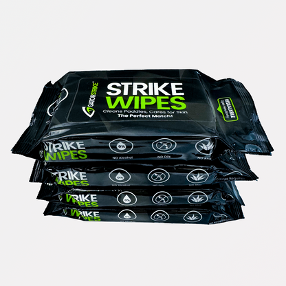 Four stacked black packs of Strike Wipes for cleaning, each labeled with green and white text and GatorStrike pickleball manual.