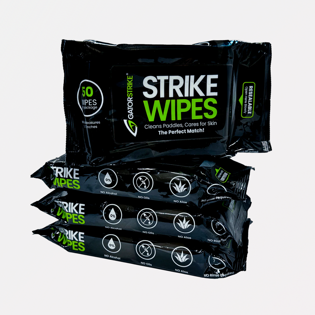Four black packs of GRIPSTRIKE Strike Wipes stacked, labeled for cleaning paddles—great for any pickleball manual.